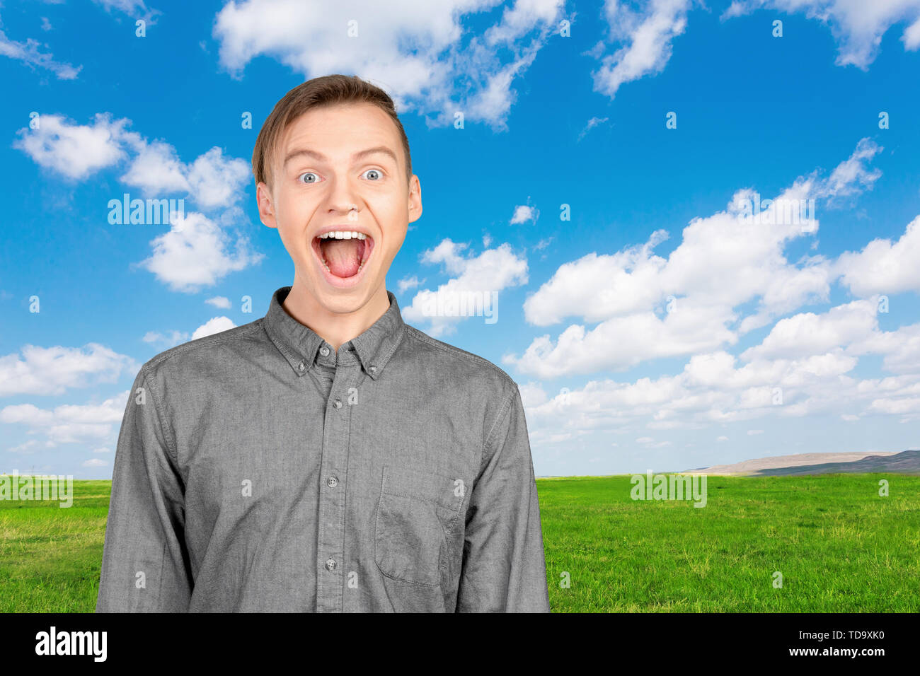 Portrait of young man with shocked facial expression Stock Photo - Alamy