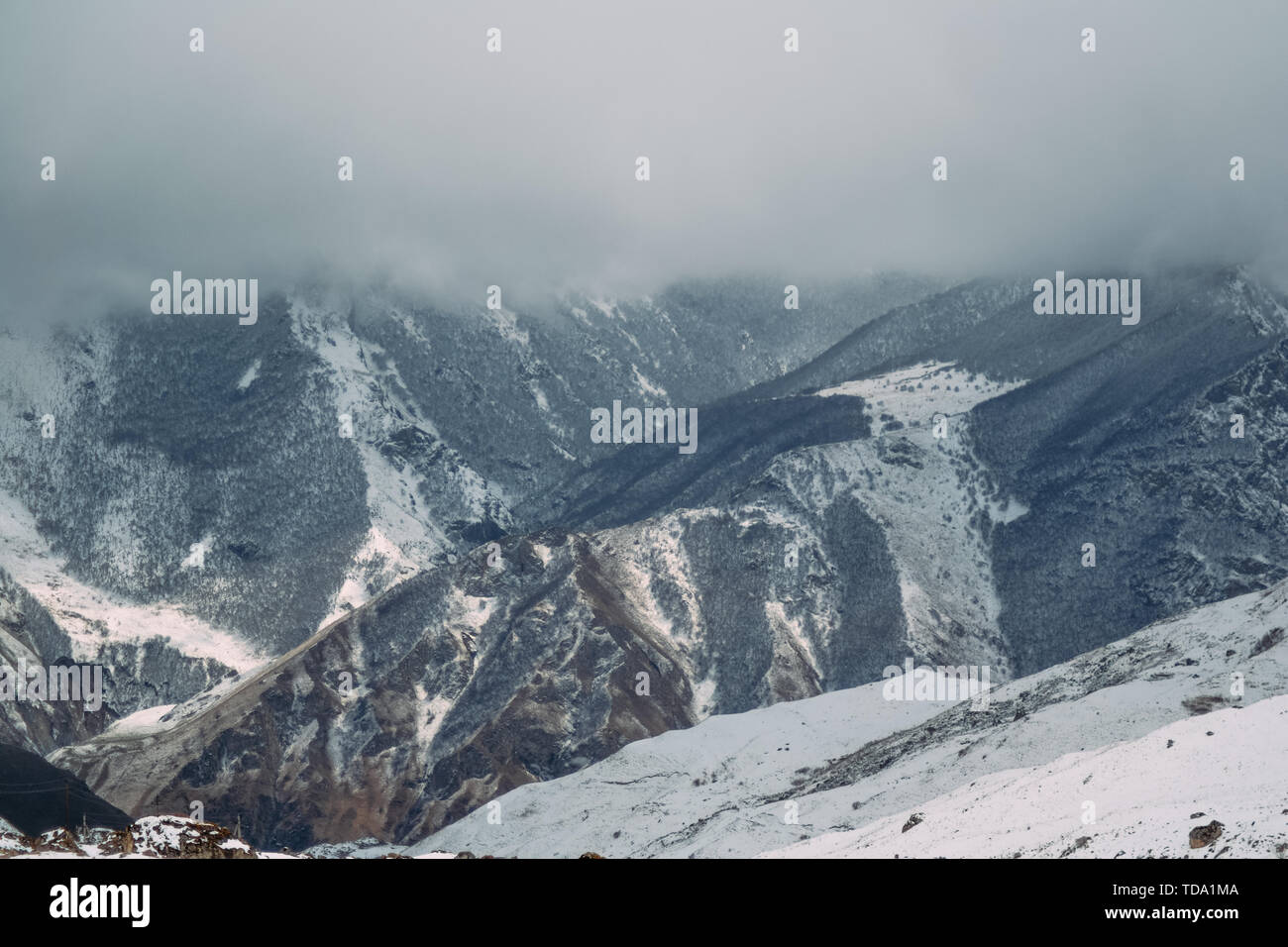 landscape of high mountains covered with snow Stock Photo - Alamy