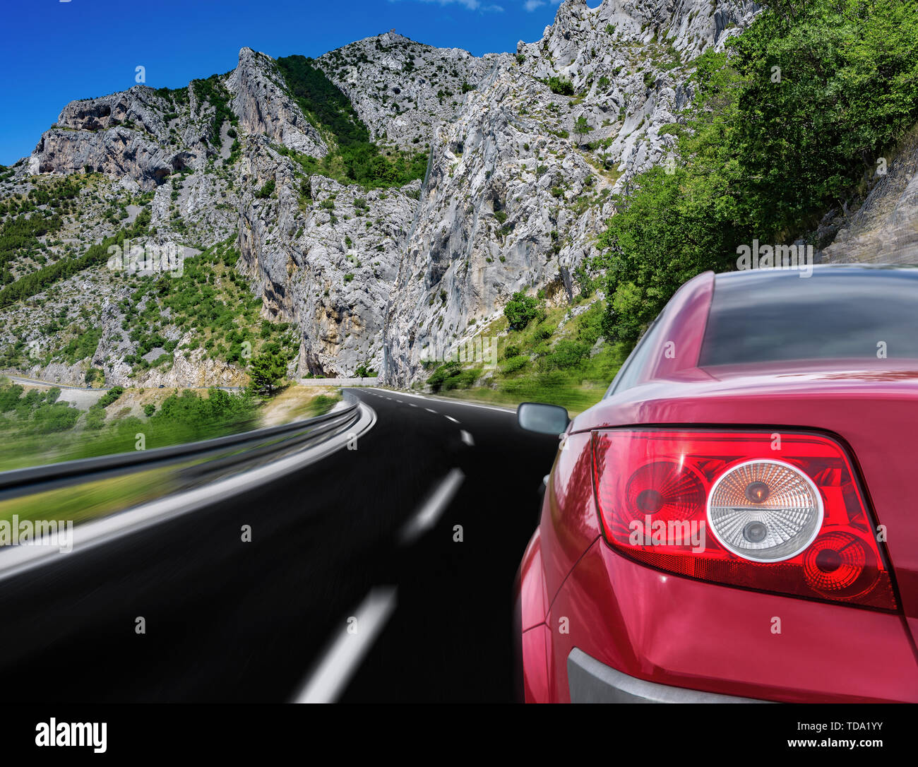 Red car rushing along a high-speed highway Stock Photo - Alamy