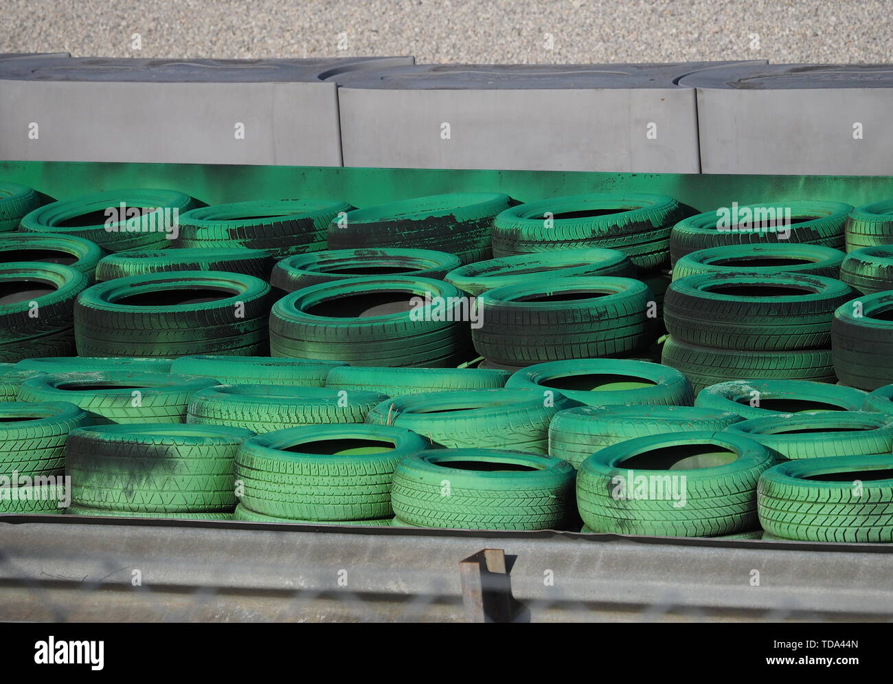 Green car tires, used for safety on Monza circuit Stock Photo