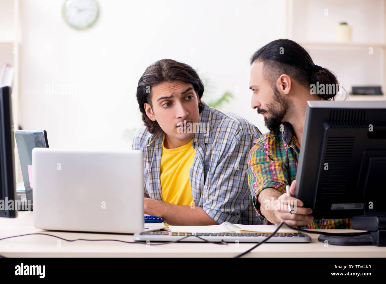 Two it specialists working in the office Stock Photo
