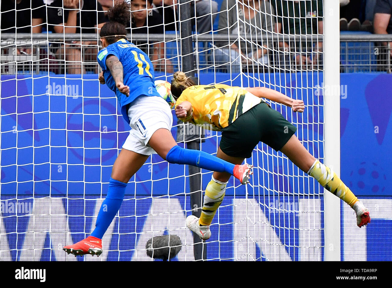 Montpellier. 13th June, 2019. Cristiane (L) of Brazil scores a head shot during the group C match between Brazil and Australia at the 2019 FIFA Women's World Cup in Montpellier, France on June 13, 2019. Credit: Chen Yichen/Xinhua/Alamy Live News Stock Photo