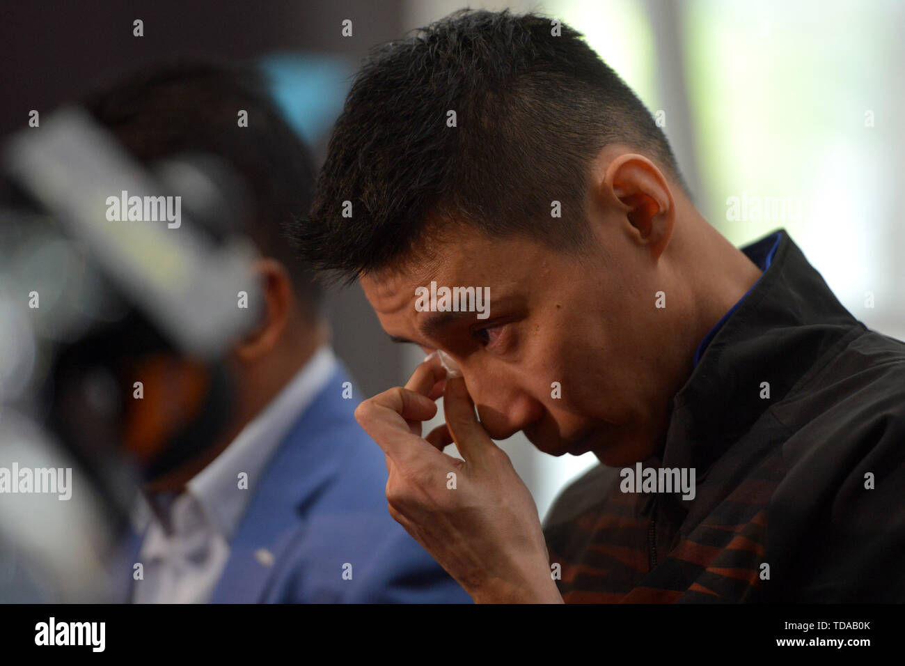 Beijing, Malaysia. 13th June, 2019. Malaysia's badminton player Lee Chong Wei reacts during a news conference to announce his retirement in Putrajaya, Malaysia, June 13, 2019. Credit: Chong Voon Chung/Xinhua/Alamy Live News Stock Photo