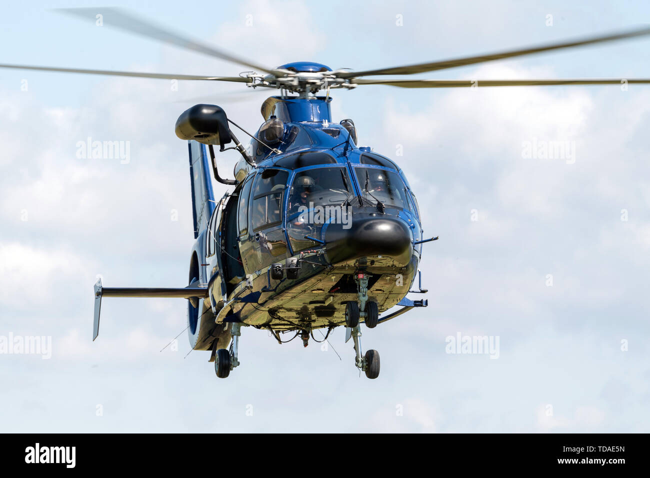 13 June 2019, Saxony, Nünchritz: An EC 155 b1 helicopter flies in the sky from the Elbe during a helicopter-assisted water rescue exercise. The Bundespolizei-Fliegerstaffel Blumberg, together with the Wasserwacht Sachsen and the Deutsche Lebens-Rettungs-Gesellschaft e.V. (German Life and Rescue Society), leads the (DLRG) is conducting a joint exercise to rescue people from flowing waters. Photo: Robert Michael/dpa-Zentralbild/ZB Stock Photo