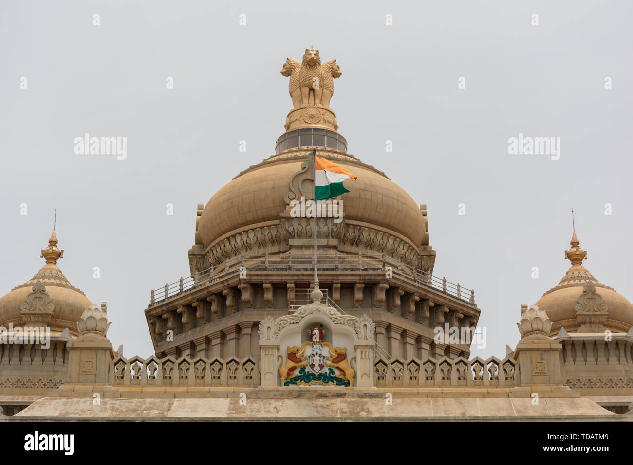 Closeup of Indian Flag waving on the dome of Vidhana Soudha at Bangaluru, India Stock Photo