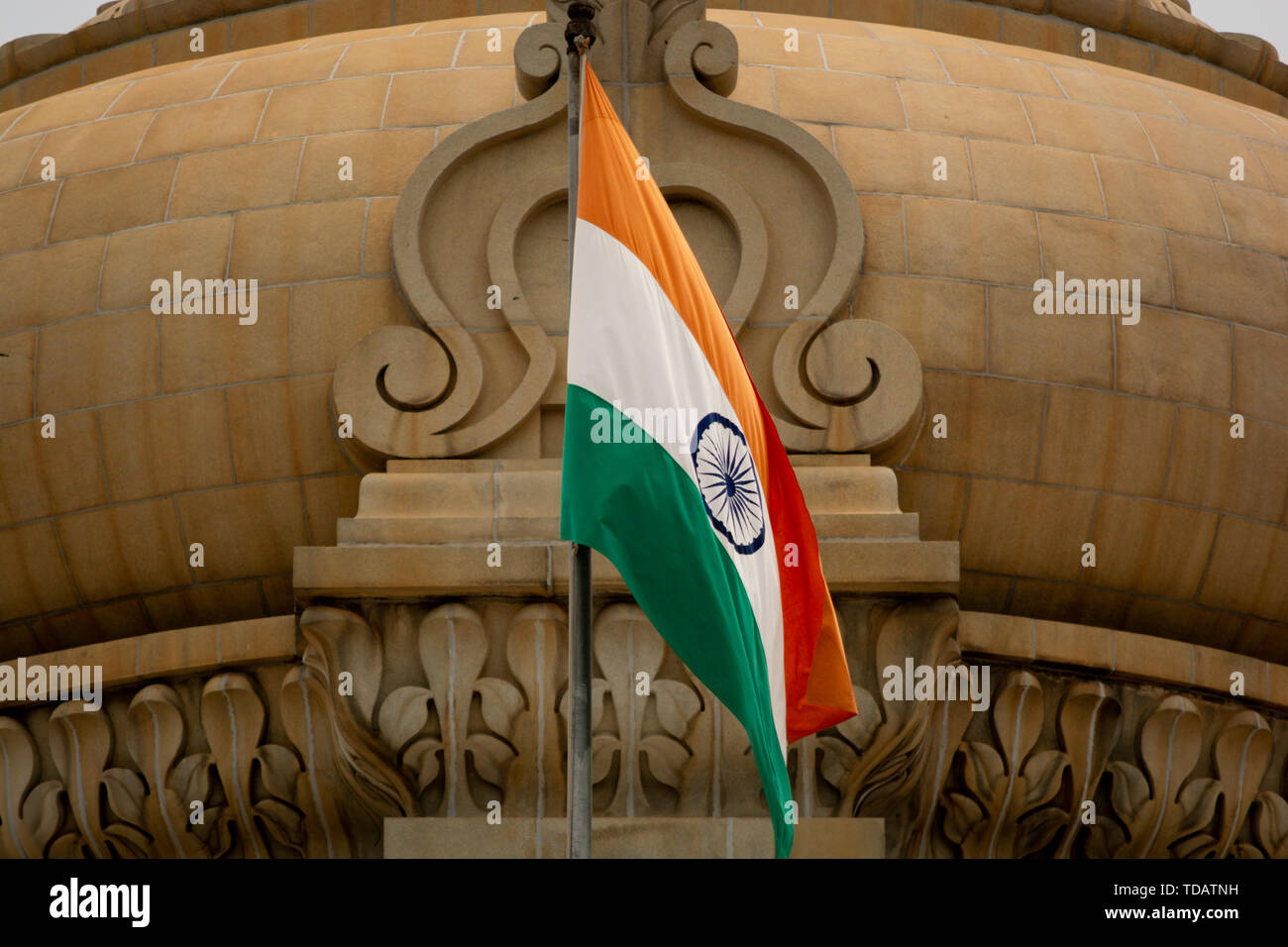 Closeup of Indian Flag waving on the dome of Vidhana Soudha at Bangaluru, India Stock Photo