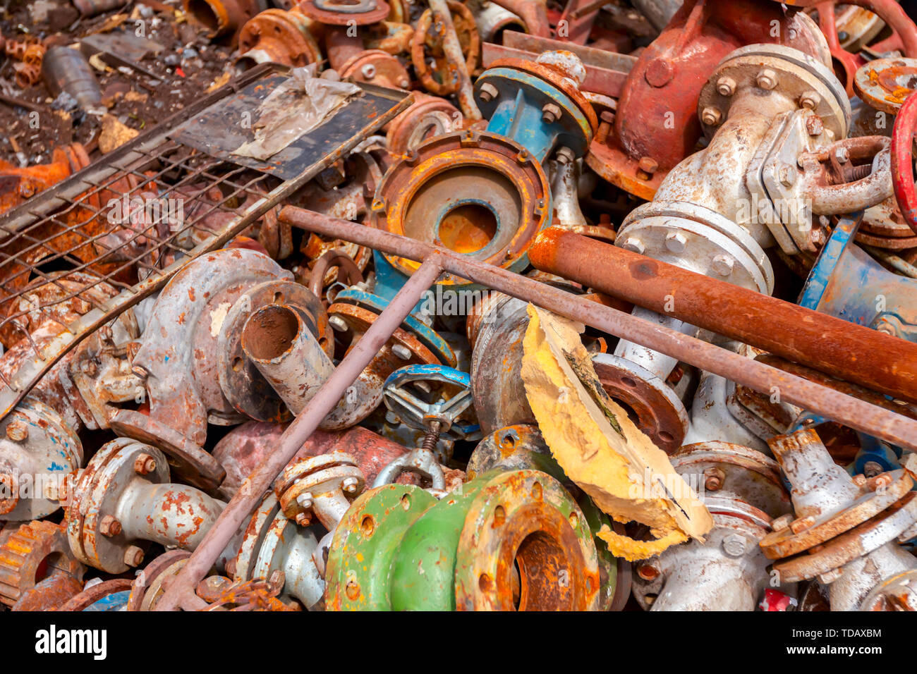 Different shapes and sizes of cut old valves and equipment, industrial