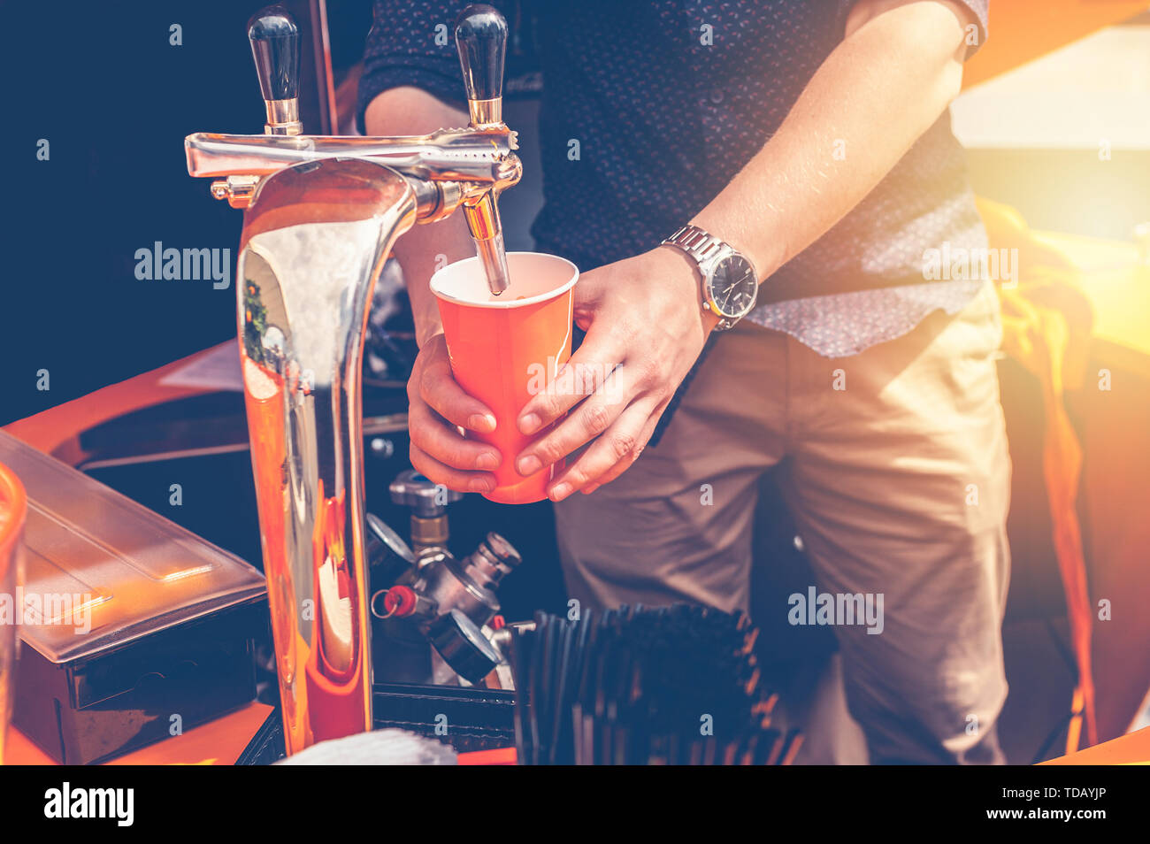 Bartender preparing a summer cocktail Aperol. Men's hands in the frame Stock Photo
