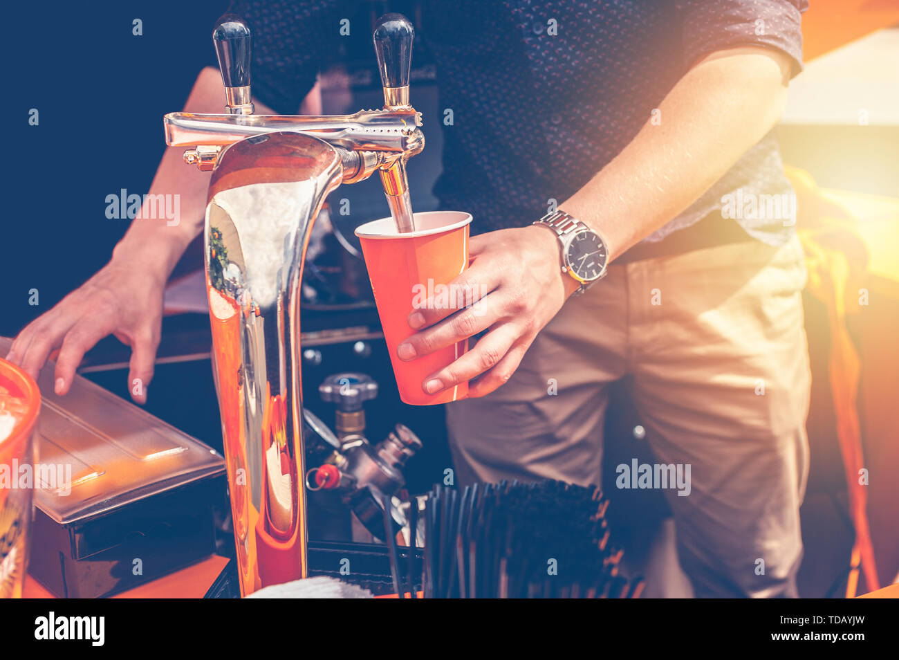 Bartender preparing a summer cocktail Aperol. Men's hands in the frame Stock Photo