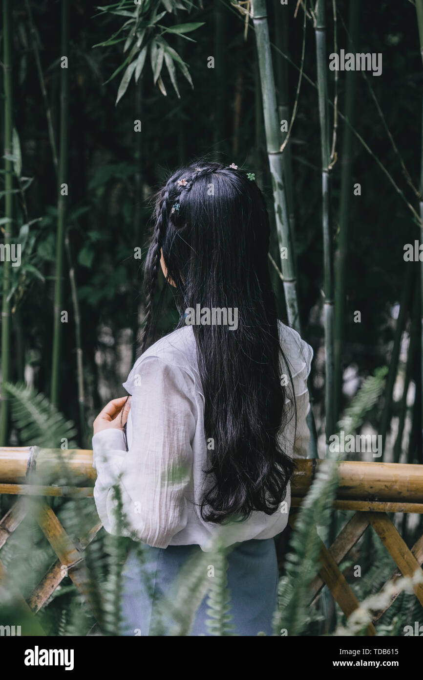 A young girl in the ancient bamboo forest Stock Photo Alamy