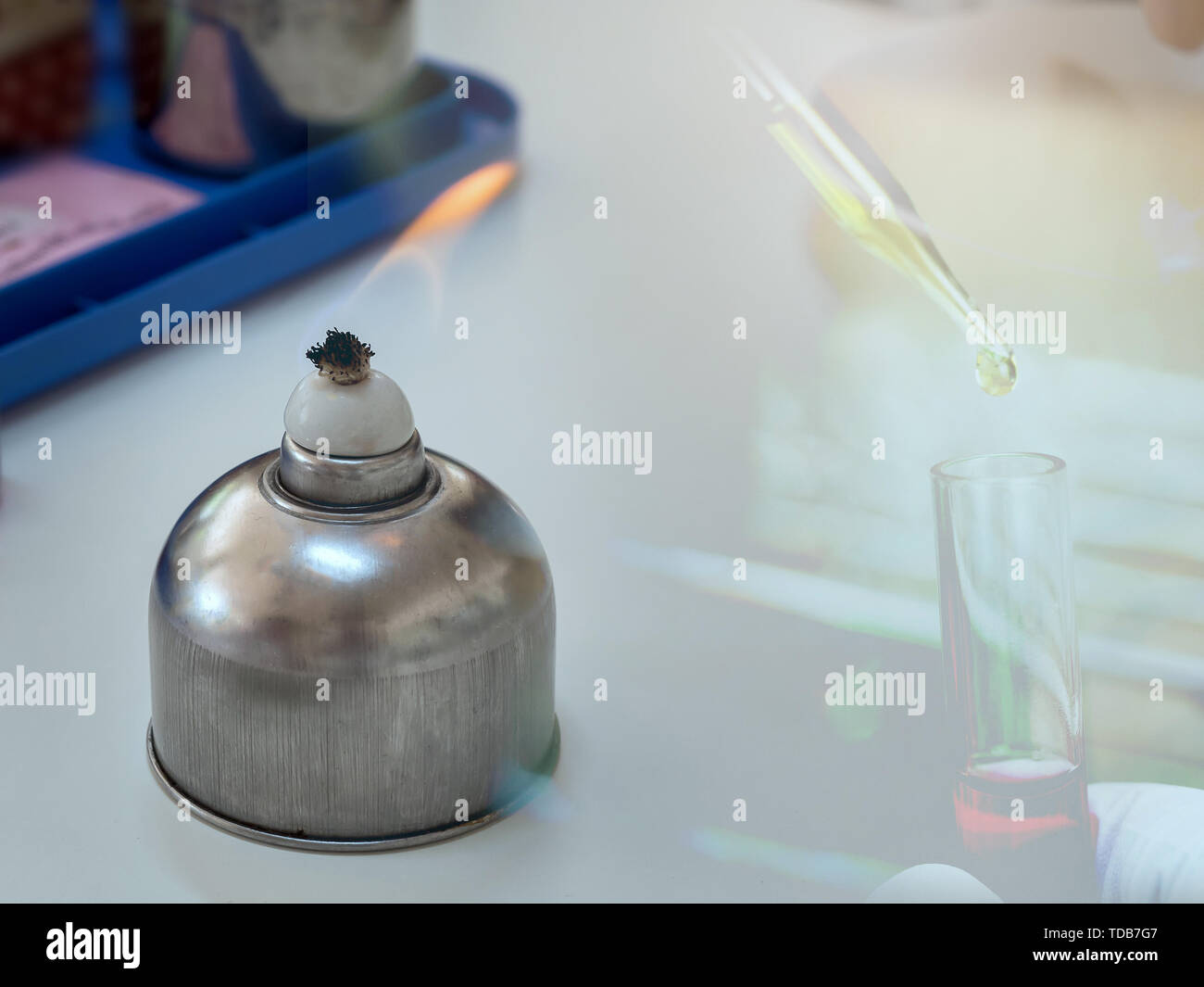 Alcohol burner and test tube in rack,science laboratory research and
