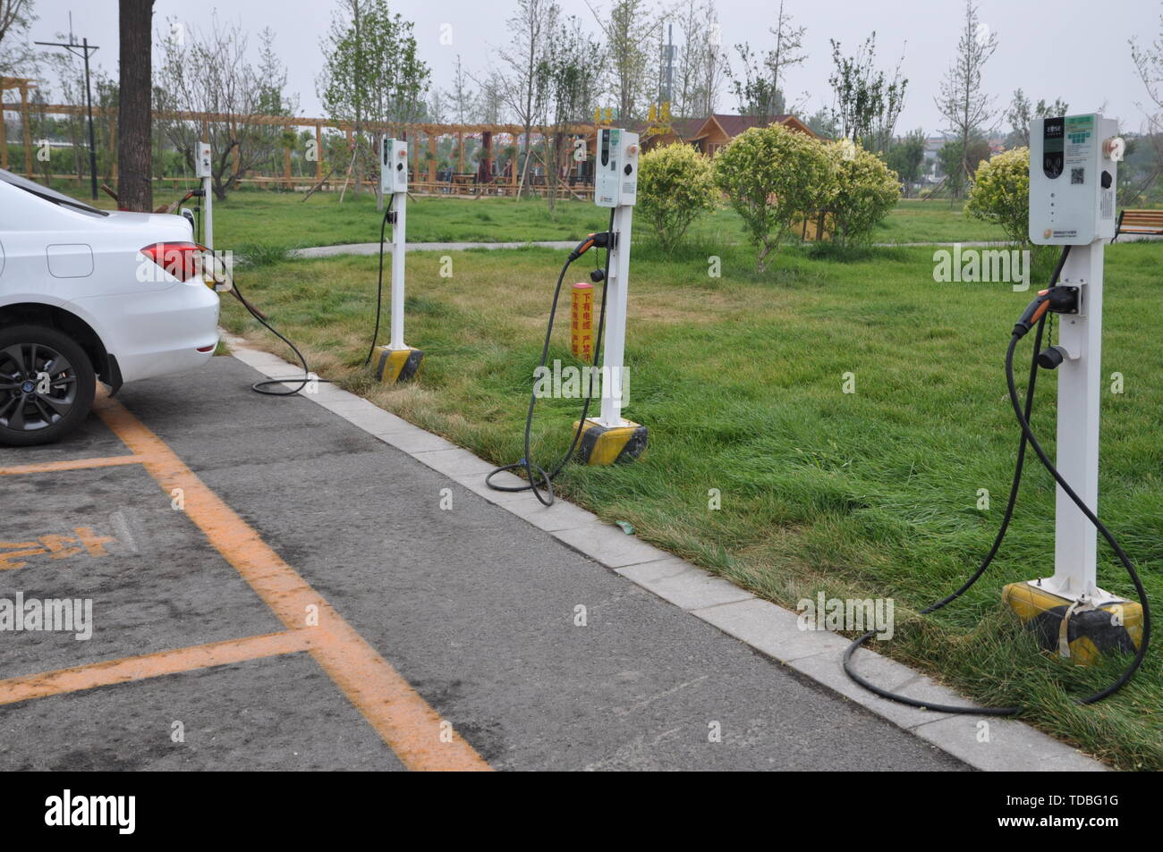 Electric vehicle charging pile Stock Photo - Alamy