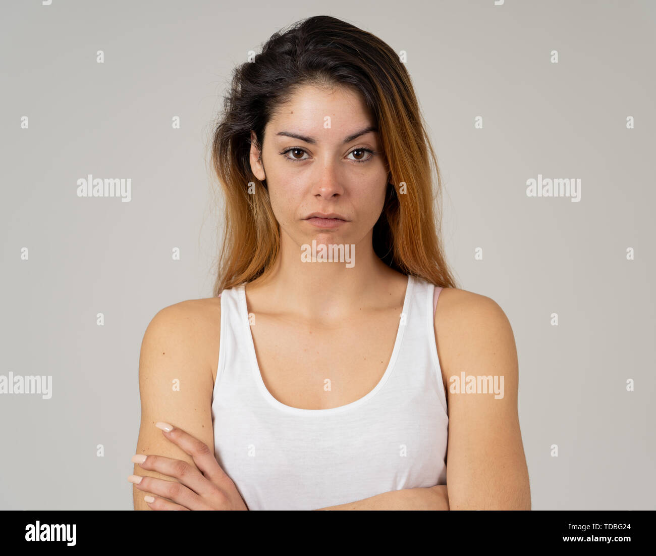 Facial expressions, emotions Anger. Young attractive caucasian woman with angry face. Looking mad and aggressive making furious gestures. Studio portr Stock Photo