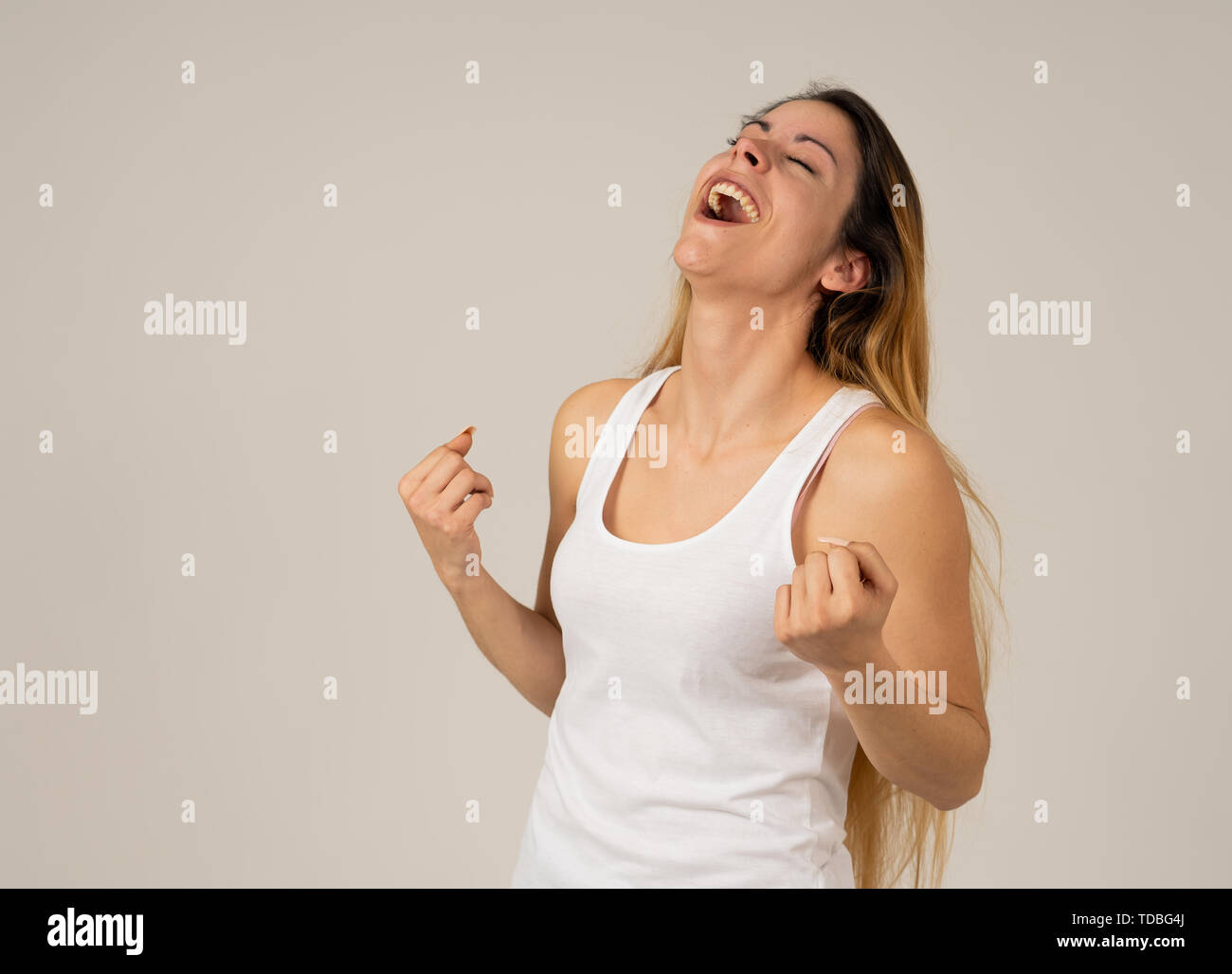 Portrait of beautiful shocked teenager girl winning or having great success with surprised and happy face feeling so excited. Human Expression Positiv Stock Photo