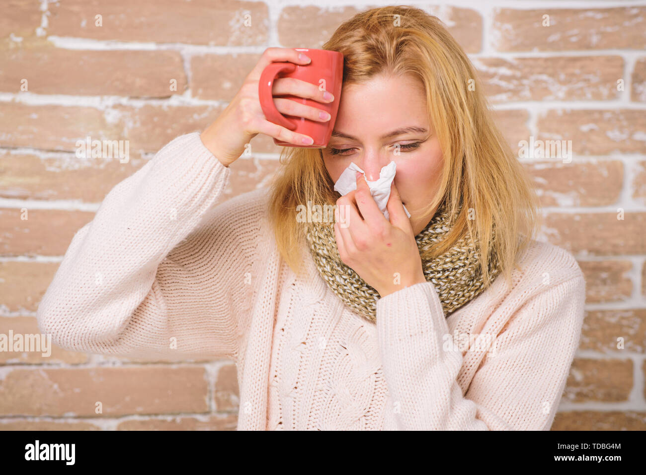 Runny Nose Symptom Of Cold Tips How Get Rid Of Cold Remedies Should Help Beat Cold Fast Woman Feels Badly Ill Sneezing Cold And Flu Remedies Girl In Scarf Hold Tissue Or