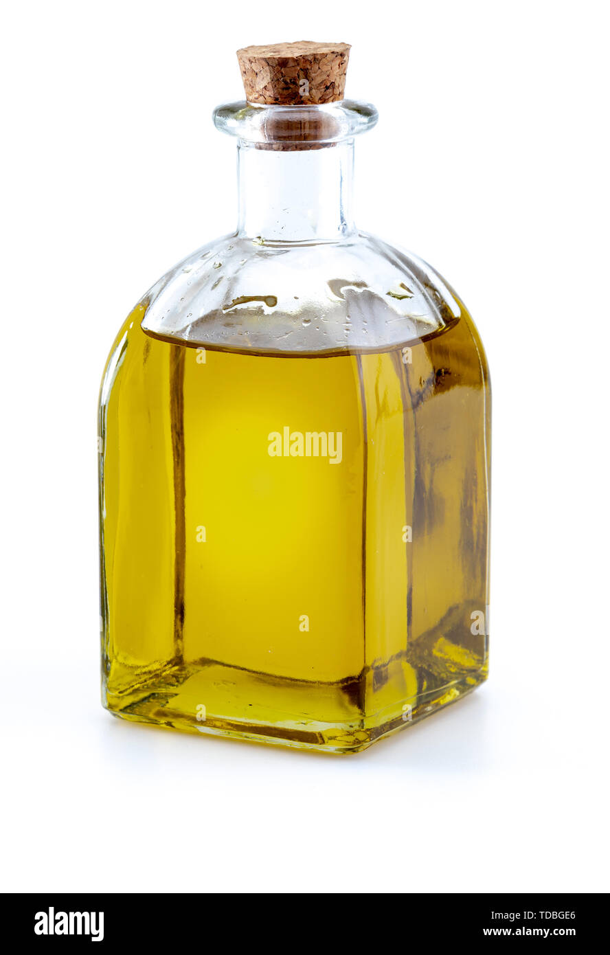 Extra virgin olive oil in glass bottle. Foreground. Isolated on white ...