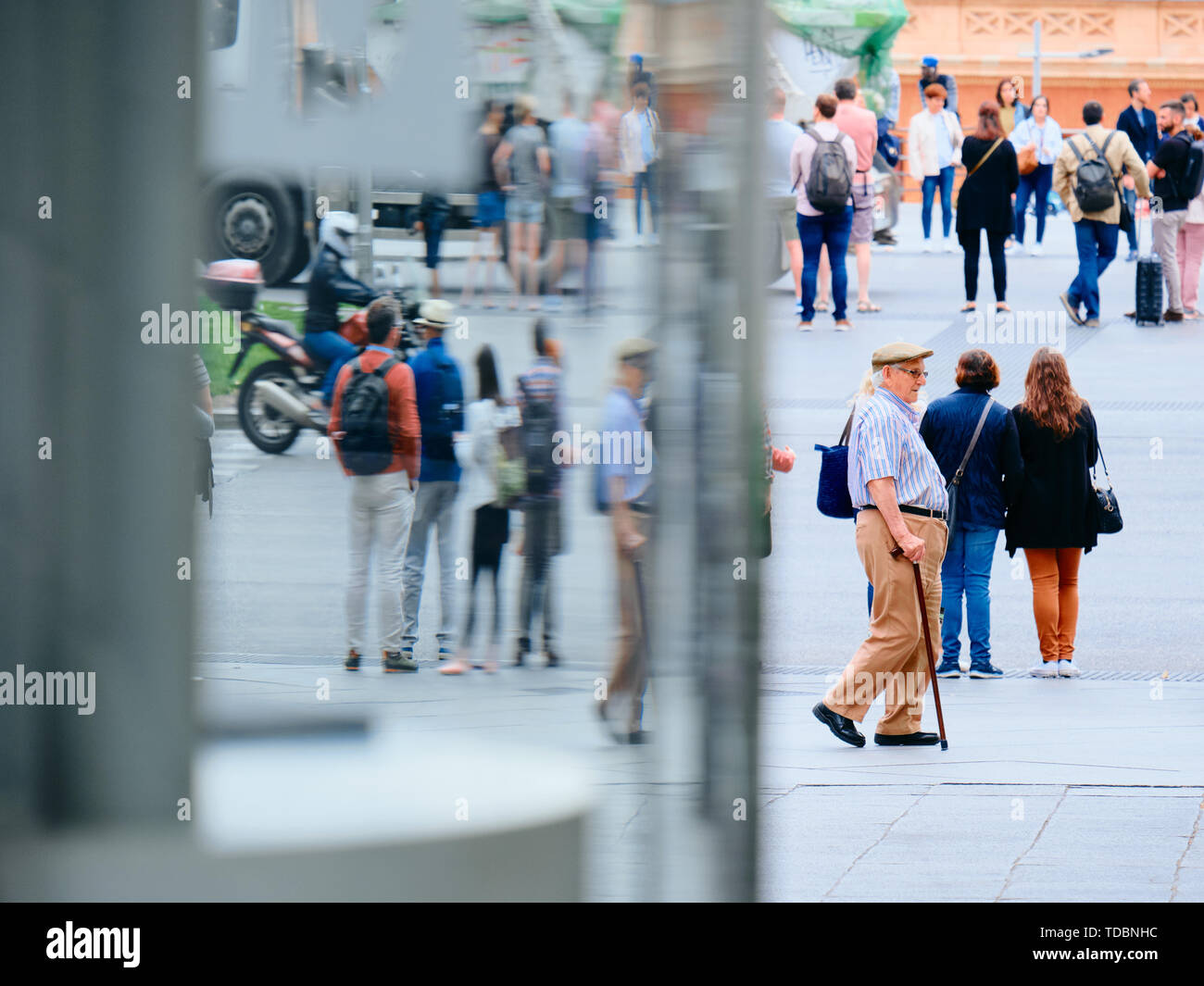 People commuting and walking near Atocha train station in Madrid Stock Photo
