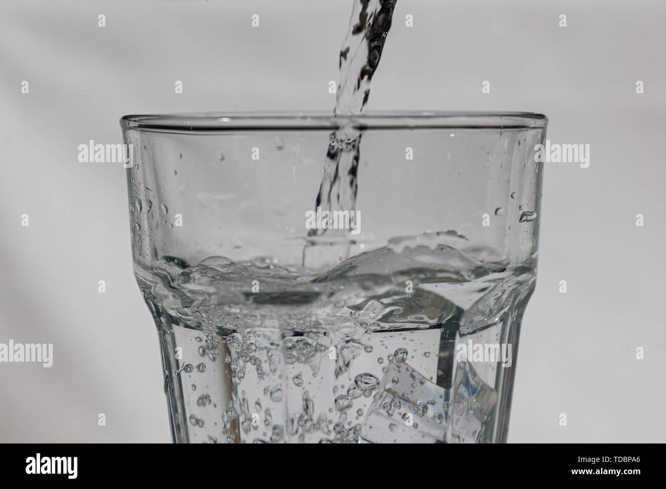 Water being poured into a glass Stock Photo Alamy