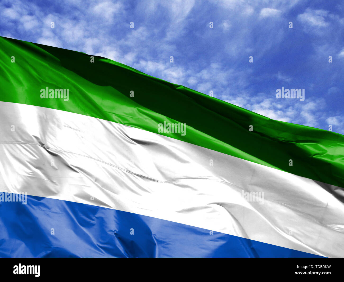 waving flag of Sierra Leone close up against blue sky Stock Photo - Alamy