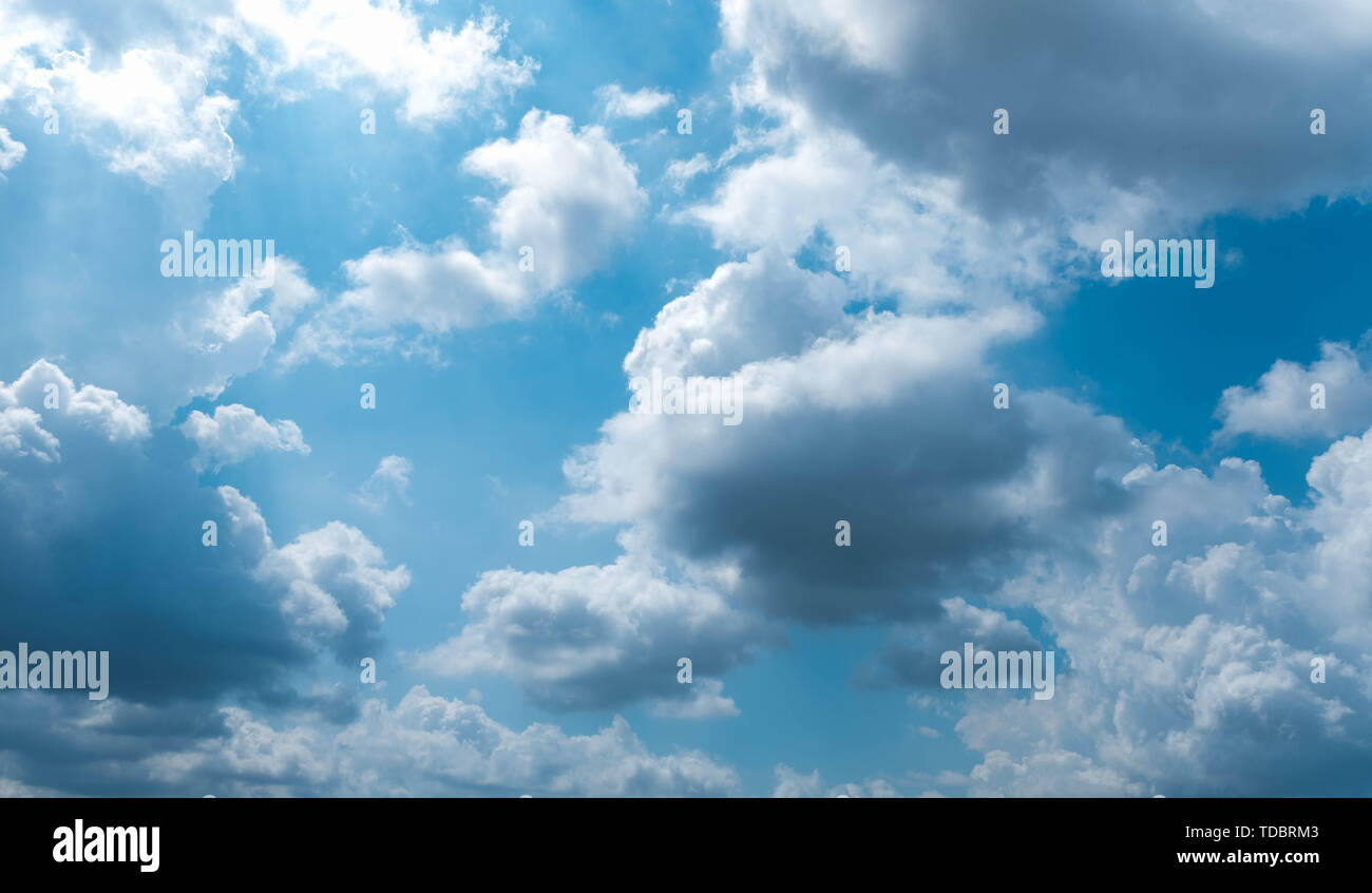 Clouds at sunset before rain blue sky white and grey clouds Stock Photo