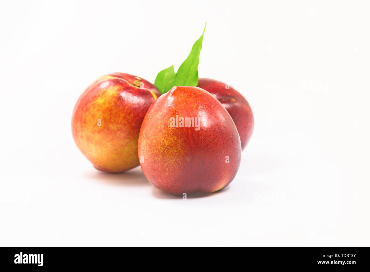 nectarines on white background Stock Photo