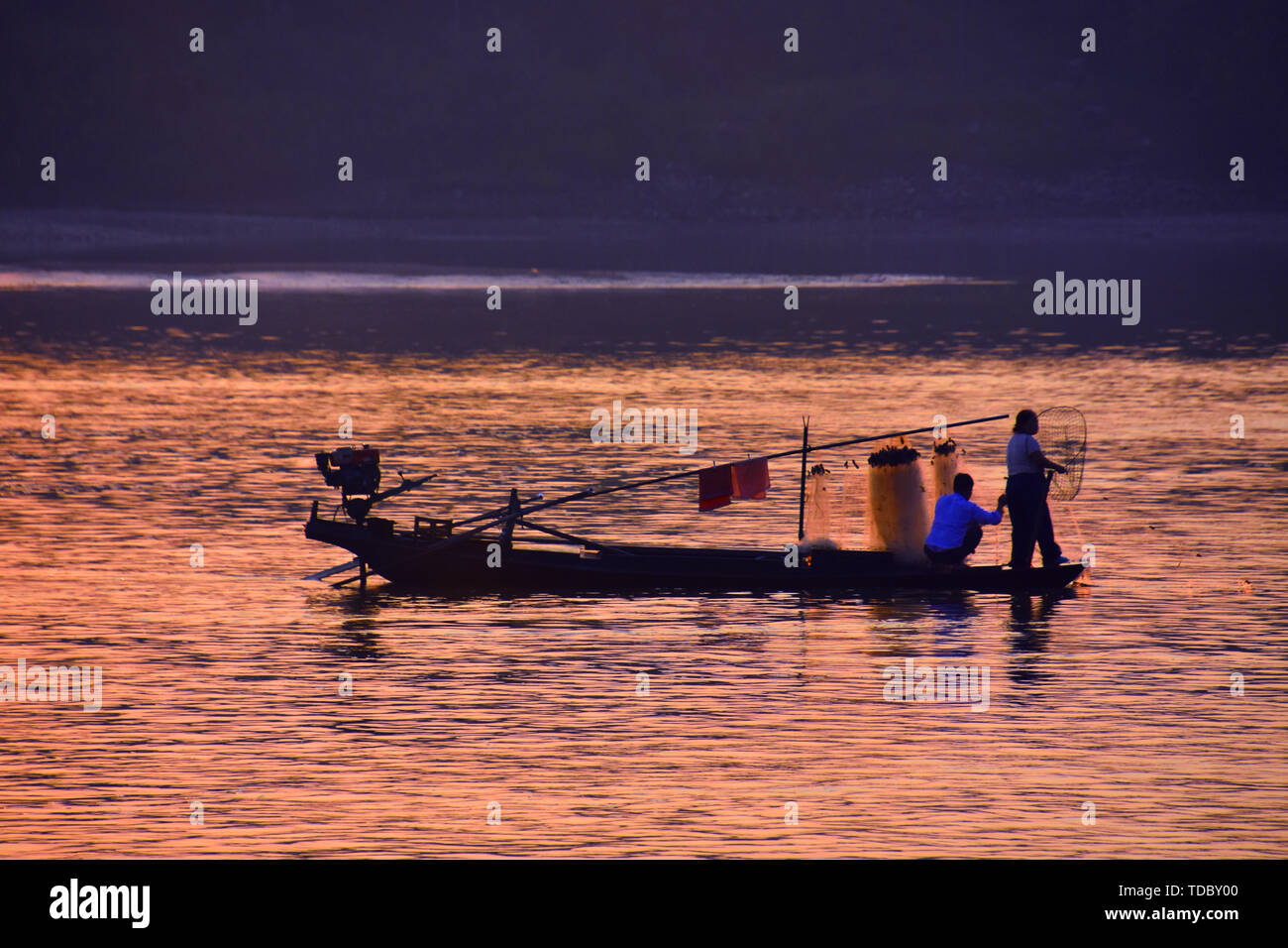 A fishing boat in the morning light Stock Photo - Alamy