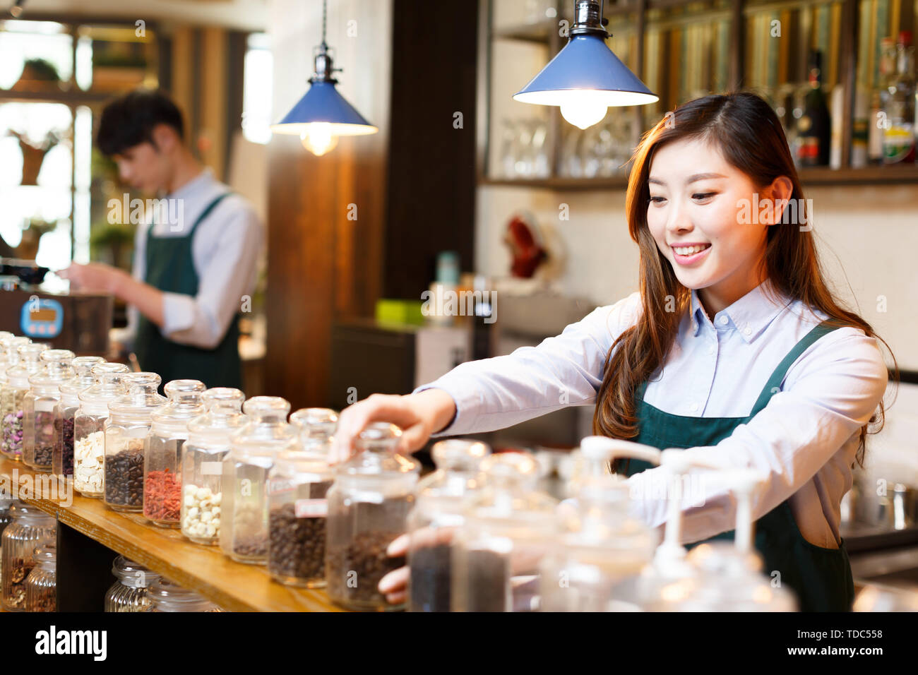 Make Waiters Make it waitress and waiter in cafe Stock Photo - Alamy