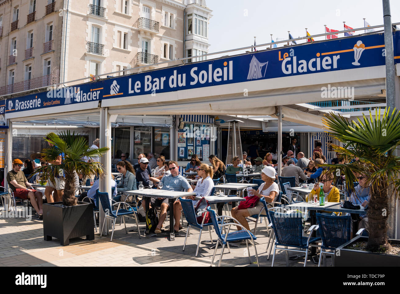 People at beach cafe, Dinard, Brittany, France Stock Photo