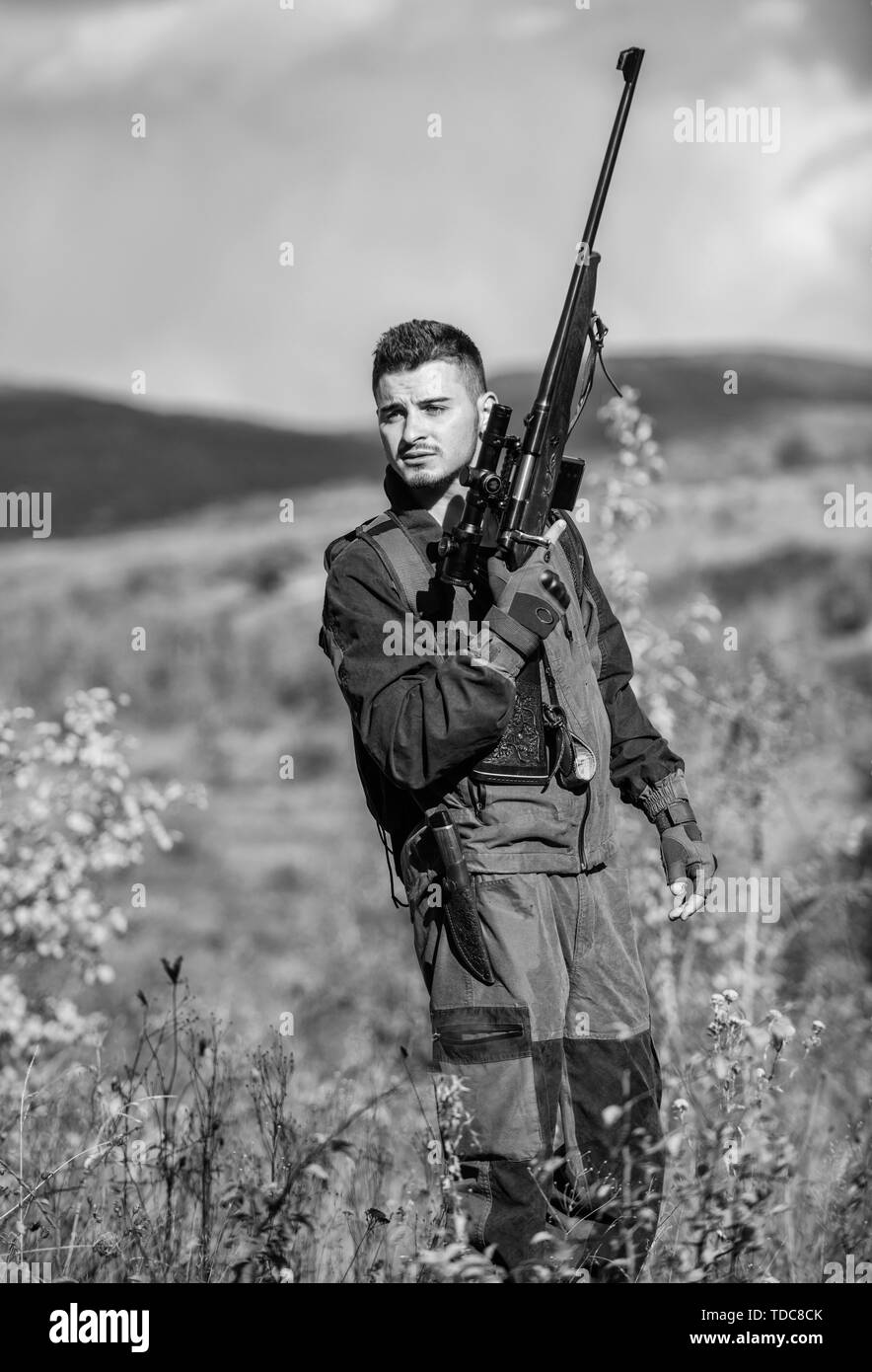 Man With Rifle Gun man sit Black and White Stock Photos & Images - Alamy