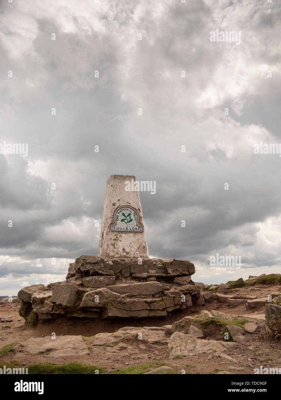 The trig or trigonometry sign at the summit of Sugar Loaf mountain Brecon Beacons National Park Wales UK Stock Photo