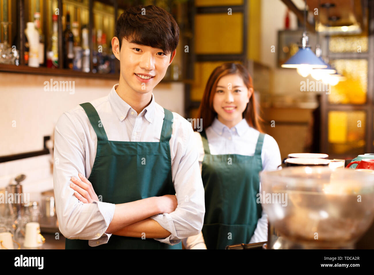 Make Waiters Make it waitress and waiter in cafe Stock Photo - Alamy