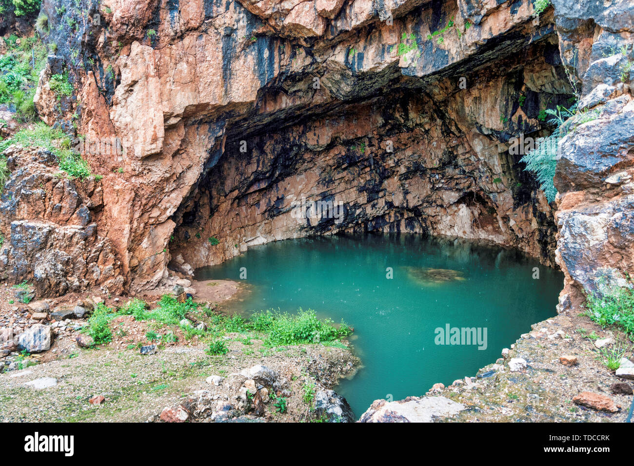 The Grotto of the God Pan 3rd Century BCE filled with water ,Hermon Stream Nature reserve and Archaeological Park ,Banias, Golan Heights Israel Stock Photo