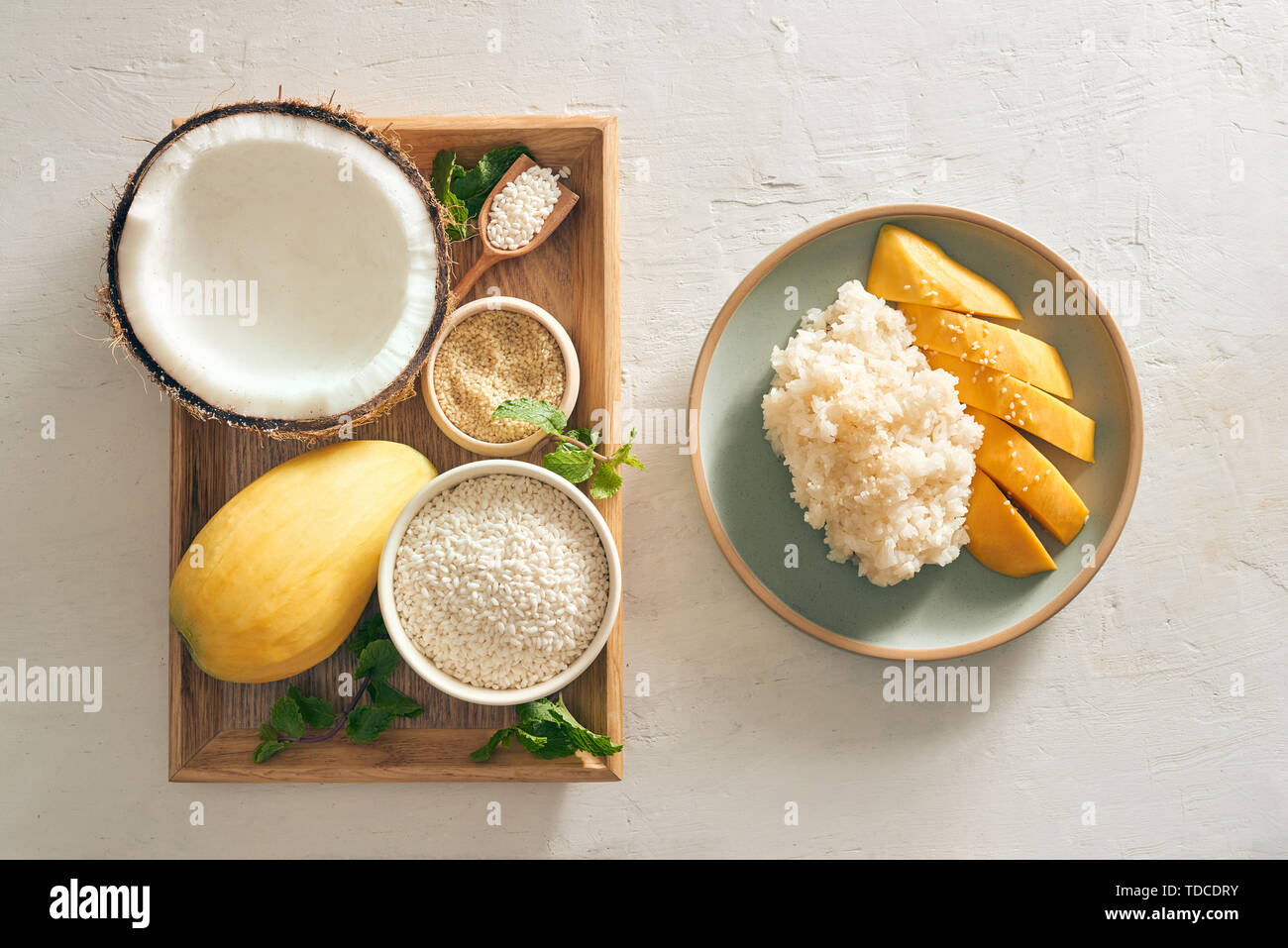 Thai Dessert - Mango Rice Sticky with mango, coconut, rice, semame on tray Stock Photo