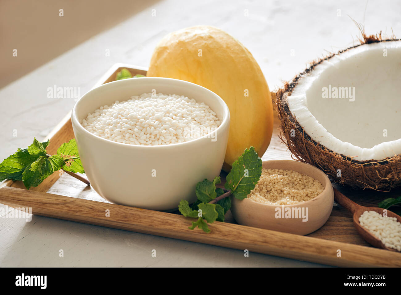 Sticky Rice Mango Thai Dessert with Cononut, mango, rice, sesame Stock Photo