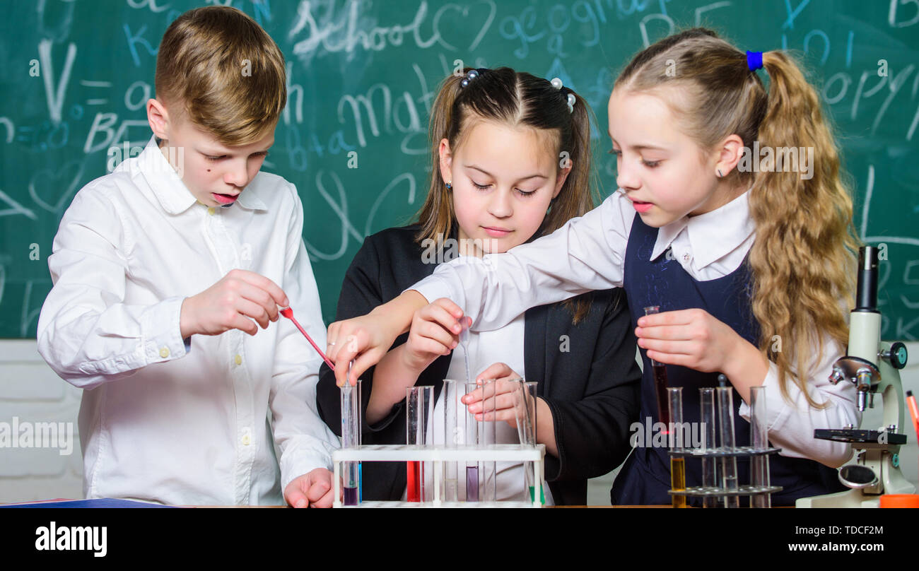 Little children. Science. biology experiments with microscope. Lab microscope and testing tubes. Chemistry science. Little kids scientist earning chemistry in school lab. Ready for final exam. Stock Photo