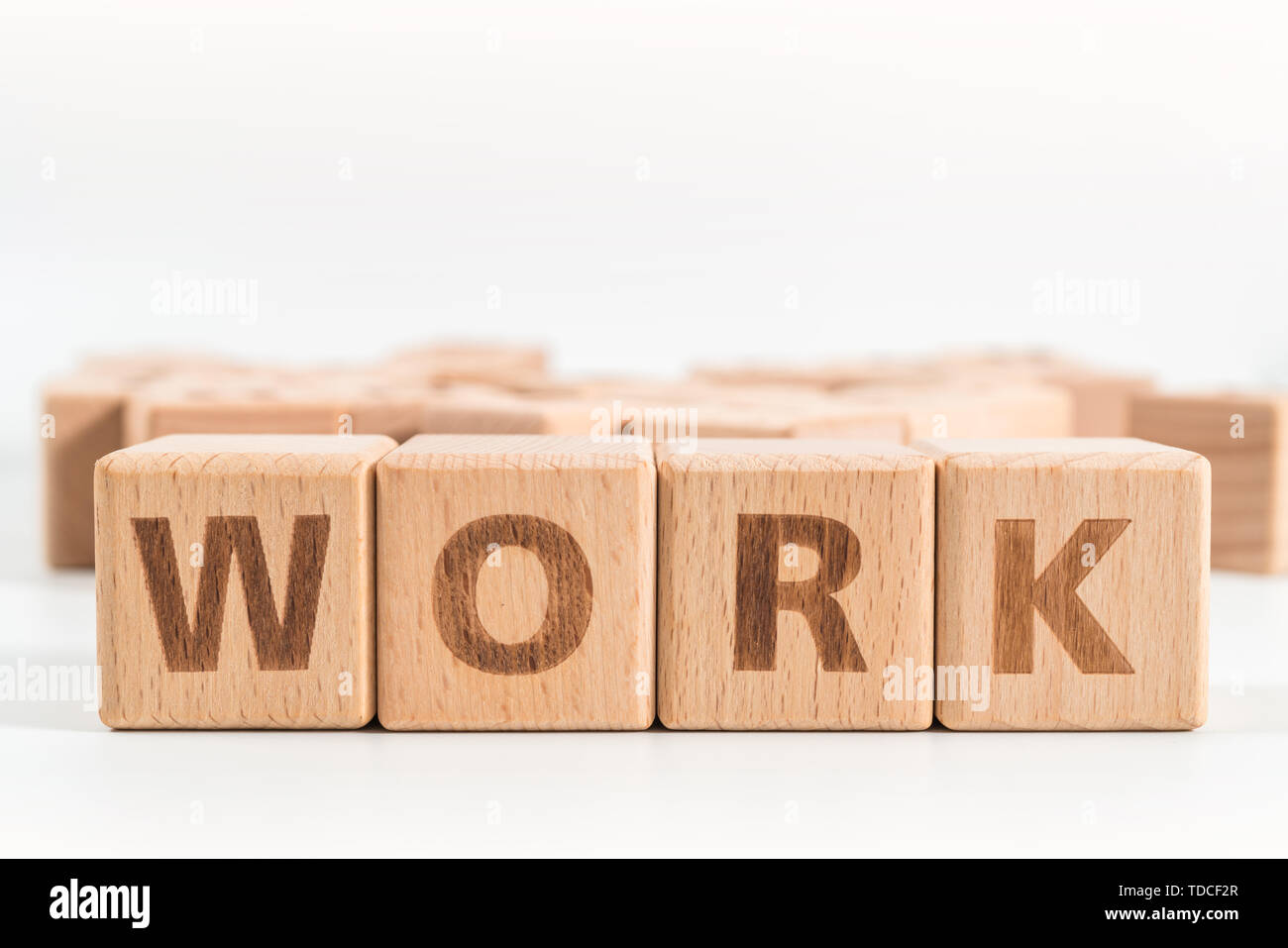 Work wooden blocks of business concept isolated on white background ...