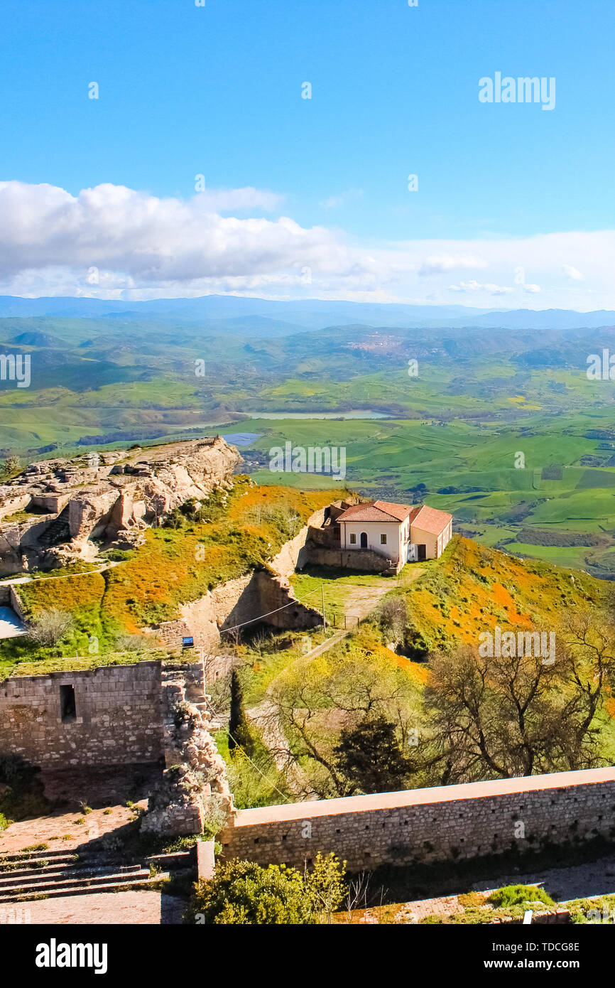 Lombardia Castle in Enna, Sicily on the top of the hill surrounded by amazing rural landscape and Sicilian mountains. Norman era castle, beautiful Italy. Popular tourist spot. Stock Photo