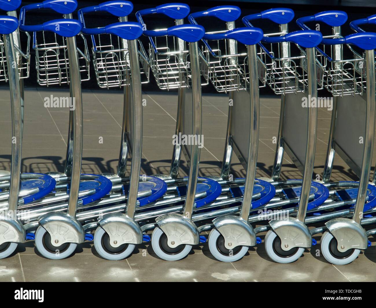Baggage or luggage carts at an airport Stock Photo Alamy
