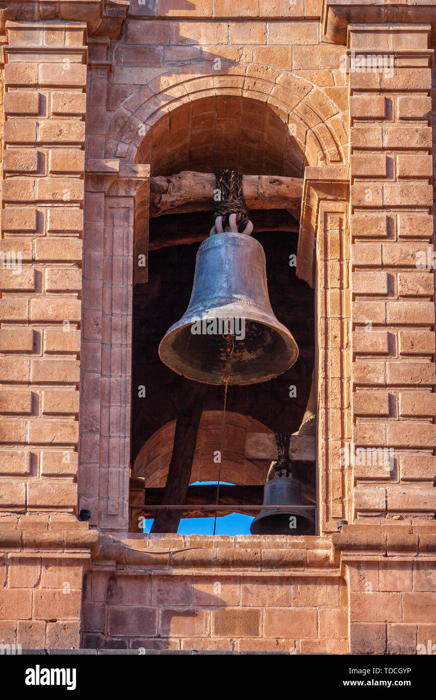 Old bell under the arch of the city Cathedral in Cusco / Cuzco, Peru. Stock Photo