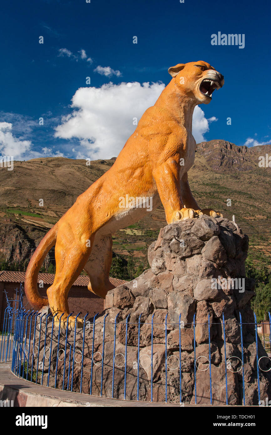 Cusco / Peru - May 29.2008: Orange color Puma the animal statue in Calca town in Peruvian Andes. Symbol of strength and power in the Inca culture. Stock Photo
