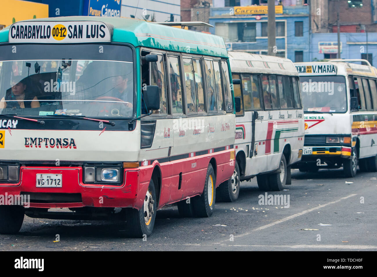 Lima / Peru Jun 13.2008: Very common city transportation bus waiting in the traffic on the crowded streets. Daytime. Stock Photo