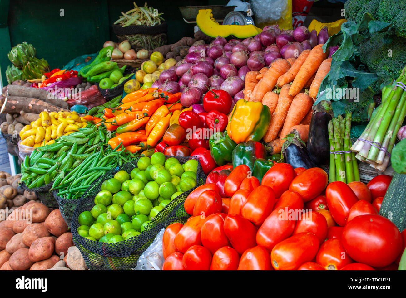 Colorful display of the variety fruits and vegetables on the market stand in Lima, Peru. Stock Photo