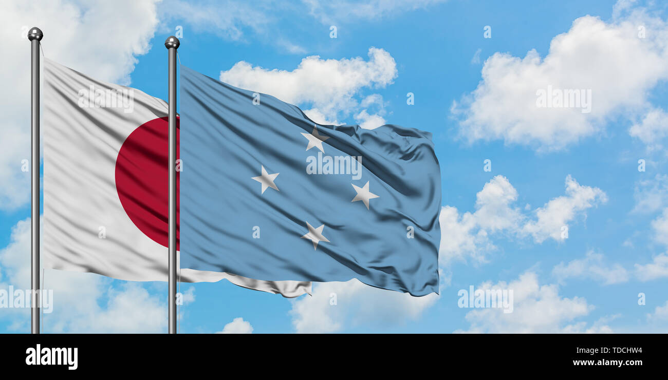 Japan and Micronesia flag waving in the wind against white cloudy blue