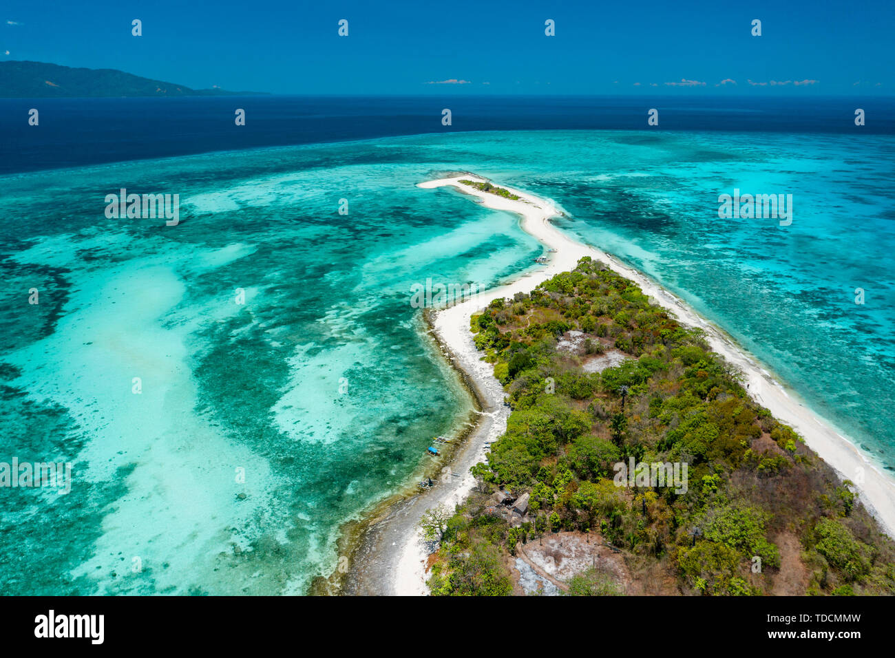 Truly amazing tropical island in the middle of the ocean. Aerial view of an island with white sand beaches and beautiful lagoons Stock Photo