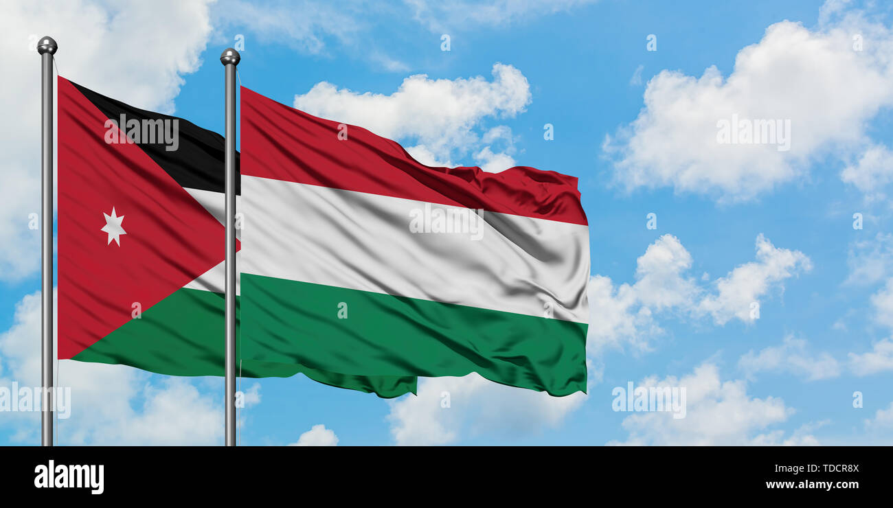 Jordan and Hungary flag waving in the wind against white cloudy blue sky  together. Diplomacy concept, international relations Stock Photo - Alamy