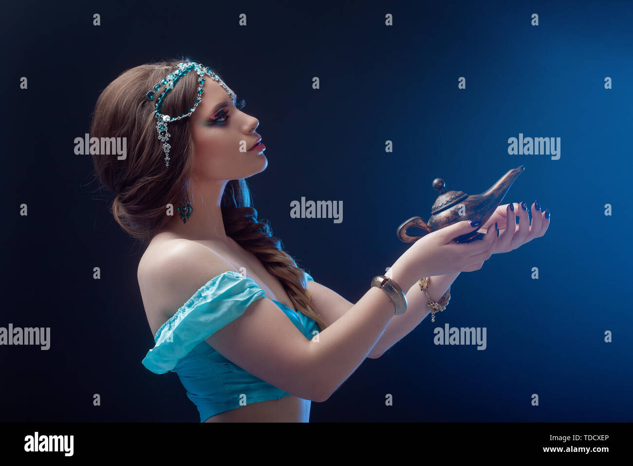 Jasmine the heroine of the Eastern fairy tale, Arab night, the girl calls gin and makes a wish. Stock Photo