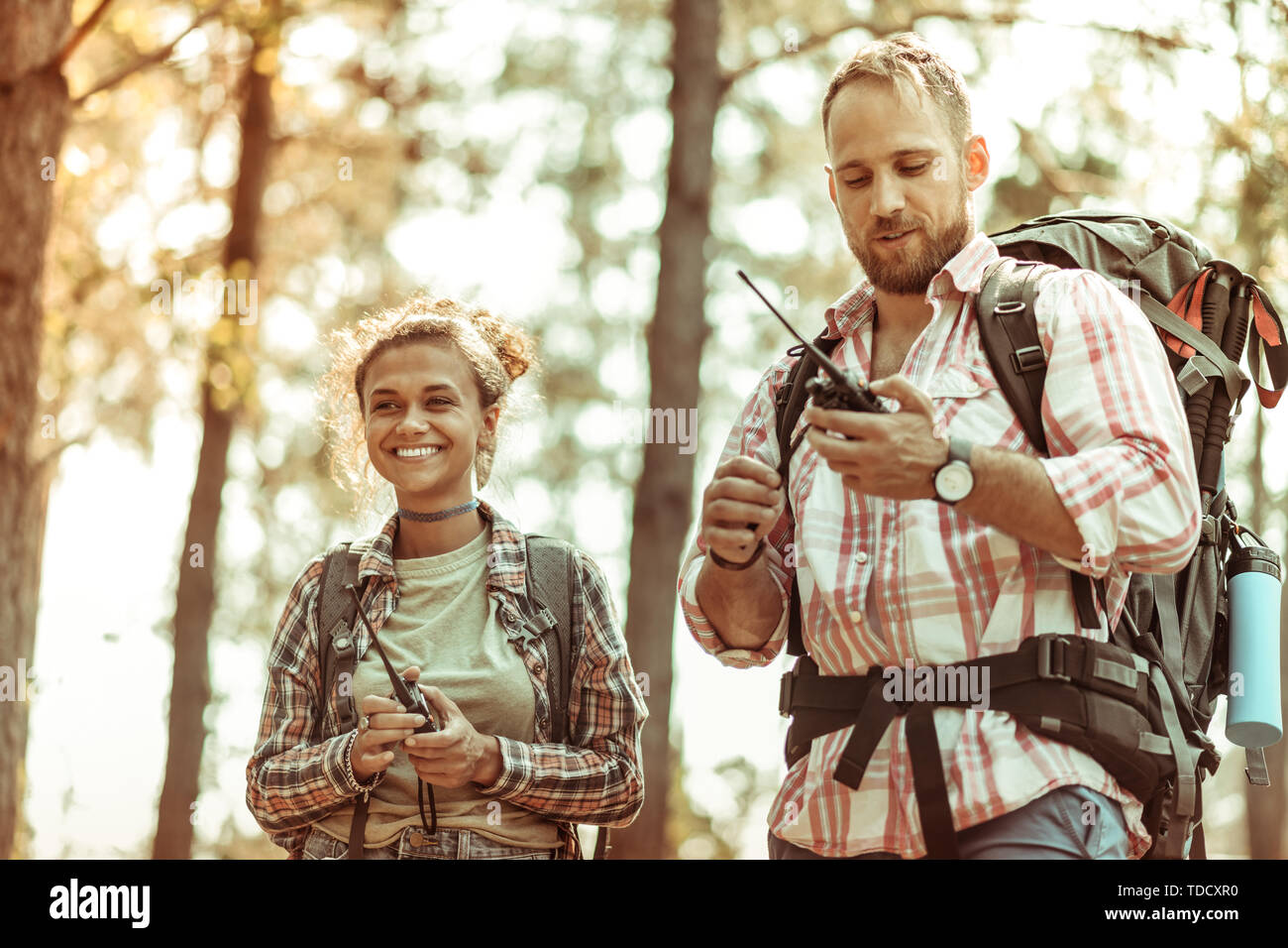 Electronic Devices Delighted Cheerful Couple Using Special Walkie electronic-devices-delighted-cheerful-couple-using-special-walkie