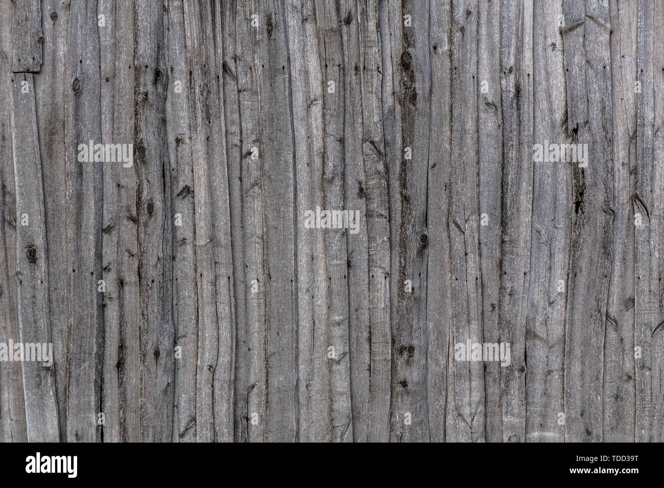 gray wooden weathered barn wall flat background template. Stock Photo