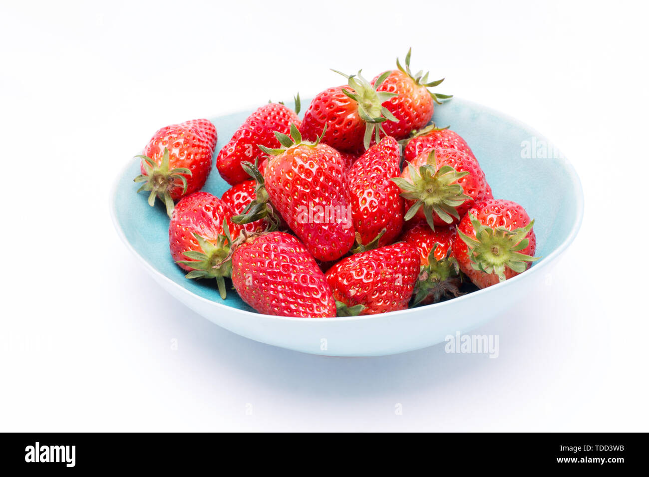 Fresh strawberries in bowl isolated on white background Stock Photo - Alamy