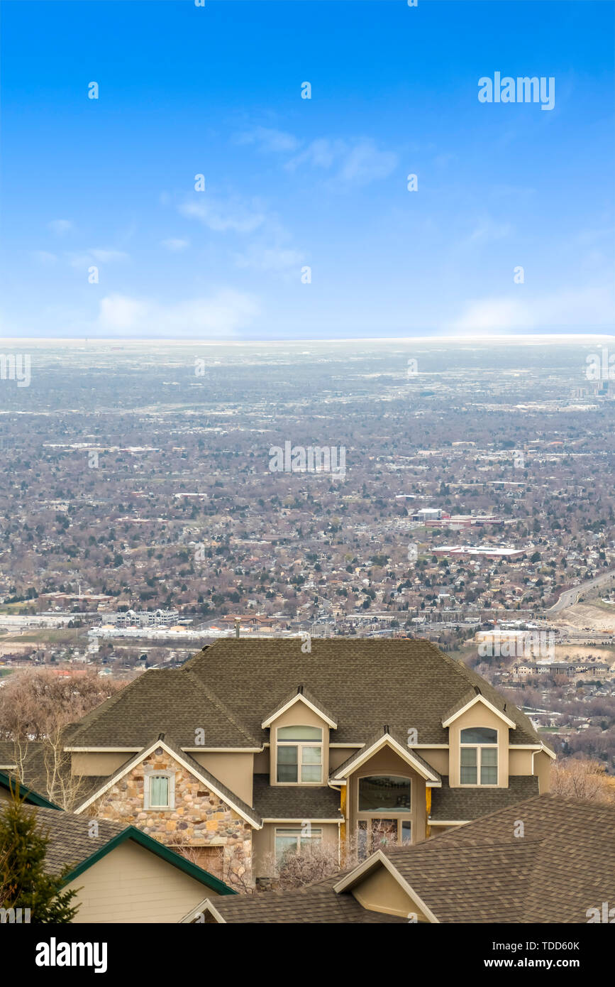 Aerial view of homes on a vast valley with the horizon and sky in the ...